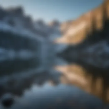 Crystal clear lake reflecting snow-capped mountains