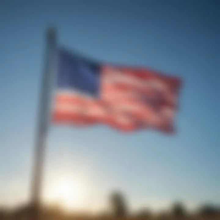 Patriotic flag waving proudly against a blue sky