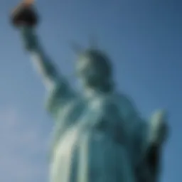 The majestic Statue of Liberty standing tall against a clear blue sky.